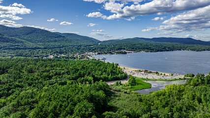 July 21, 2025 - Lake George, NY, USA.  Sunny afternoon summer aerial image of the south end of Lake George, looking north, Lake George, NY, USA.