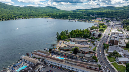 July 21, 2025 - Lake George, NY, USA.  Sunny afternoon summer aerial image of the south end of Lake George and Canada Street, Lake George, NY, USA.