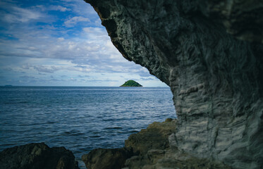 Tropical Island View Through Rock Archway in Fiji