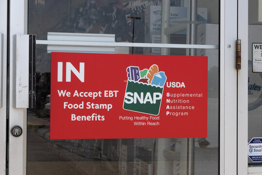 SNAP and EBT Accepted here sign. SNAP and Food Stamps provide benefits to help the budgets of disadvantaged families.