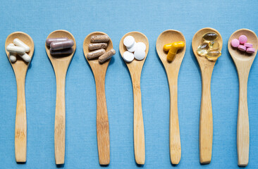 taking pills vitamins or supplements conceptual image