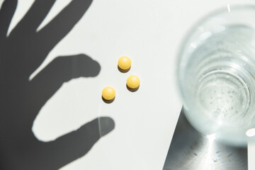 taking pills vitamins or supplements conceptual image