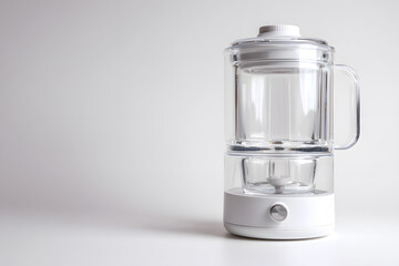 Clear beverage with filtration system on a plain white surface
