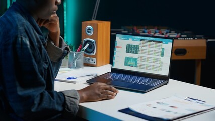 Broker investor employee checking stock exchange valuation financial profit numbers, doing...