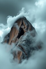 Majestic Mountain Peak Shrouded in Clouds
