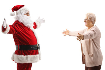 Happy elderly lady meeting santa claus