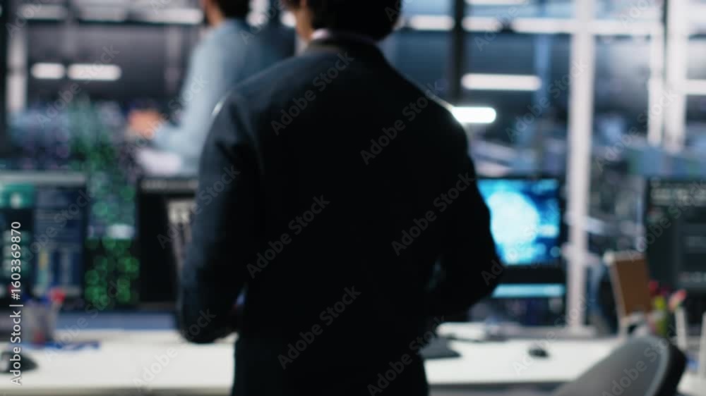 Poster programmer entering server room office, using ai to review infrastructure diagnostics. it admin in d