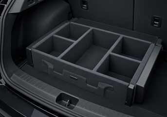 The open trunk of a modern car, revealing a practical and neatly organized storage solution with modular dividers, designed for efficient cargo management.