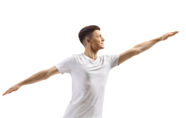 Young male in white clothes stretching