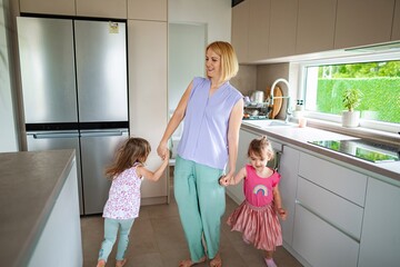 Mother and daughters enjoying playful moments together