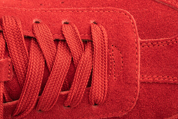 red suede sports-style winter boots, isolated on a white background
