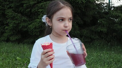 Portrait, young cute girl with ice cream in park, happy child outdoor with nature and freedom,...