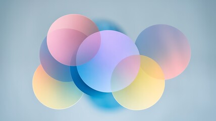 Soft pastel colored circles overlapping on a light blue background abstract