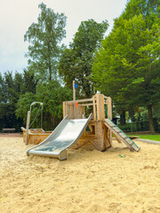 This attractive Wooden Playground Structure features exciting slides and climbing elements, nestled...