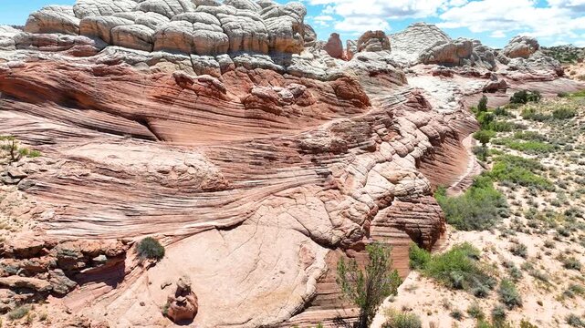 Aerial White Pocket Sandstone Formation Fly Over With Dramatic Desert Landscape