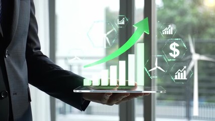Businessman Holding Tablet with Green Upward Arrow and Financial Growth Graphics - Powered by Adobe