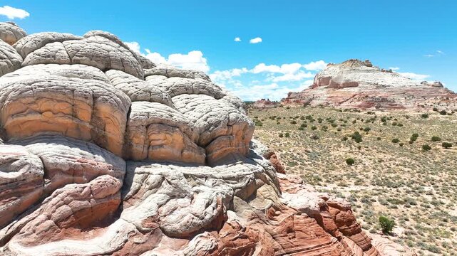 Aerial White Pocket Rock Formations and Desert Fly Through Motion