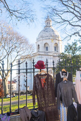 Naklejka premium Flea Market Clothes and Hat Display