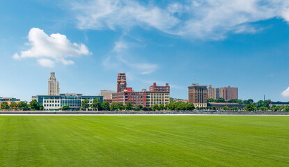 outdoor road grass skyline city building landscape cloud blue sky cityscape street travel
