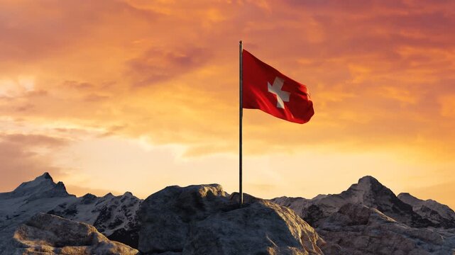 Waving Swiss flag on top of the rocks and mountains