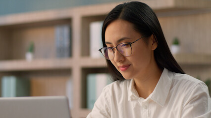 Smiling positive Asian Chinese business woman female girl happy businesswoman office worker...