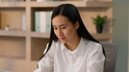 Concentrated focused Asian Korean business woman female professional CEO leader boss Japanese...