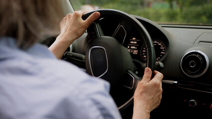 Back view Caucasian mature elderly business woman aged female businesswoman in glasses taxi driver...