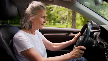 Angry frustrated disappointed Caucasian woman lady senior mature aged female client car driver in...