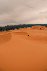 ATV resting on dunes at coral pink sand dunes