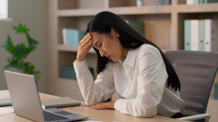 Tired upset Asian Japanese office worker employer business woman Chinese Korean female...