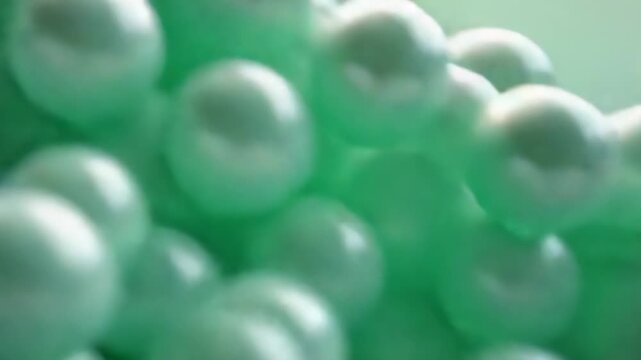 Avalanche of Mint Green Spheres Tumble and Shine