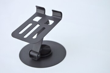 Sleek Black Metal Phone Stand on White Background Minimalist Design.