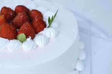 Strawberry Cake Delight Creamy Frosting Fresh Berries and Delicate Green Leaf Accent.