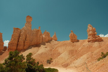 Giant rock spire and natural red rock hoodoos in Navajo Trail and combination loop at Bryce Canyon...