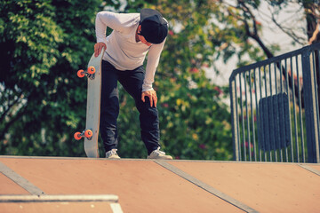 Skateboarder skateboarding at skatepark in city