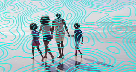 Walking family in swimsuits casting reflections on wet sand at beach edge, with shallow ocean water
