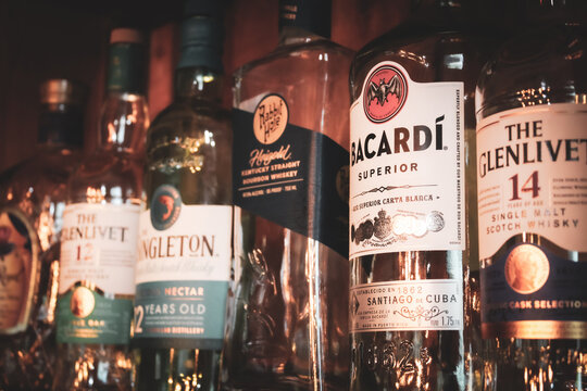 A row of decorative empty whiskey bottles in various brands. For Editorial Use Only. (July 2025)