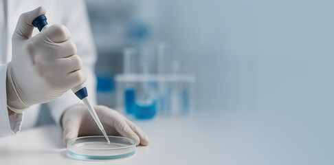 Close-up of a gloved hand using a micropipette in a laboratory. Concept of biotechnology, clinical testing, and scientific research.