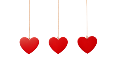 Three red hearts hanging from strings on a transparent background
