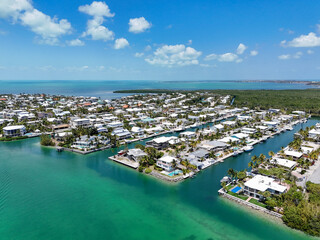 Waterfront rental and residential homes along Snake Creek at Plantation Key in Islamorada of the...
