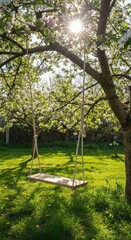 Obraz premium Spring swing in blossoming orchard