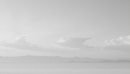 Mountains meeting water under cloudy skies clouds landscape