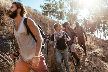 Young and diverse group of friends and hikers hiking together in the mountains of south africa