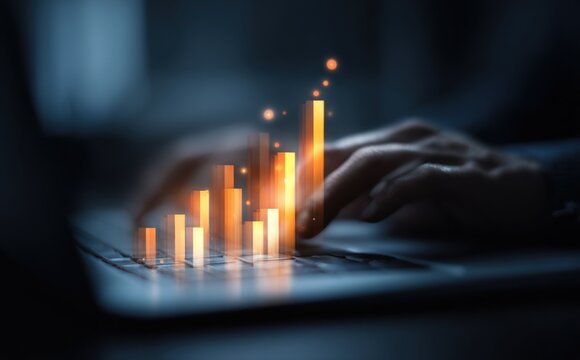 Advanced digital analysis of data trend growth with glowing orange bar graph and holographic financial statistics on modern tablet screen