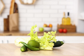 Fresh vegetables on wooden table in modern kitchen