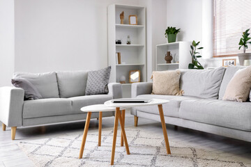 Stylish interior of living room with sofa and coffee table