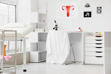 Interior of medical office with gynecologist's workplace and couch