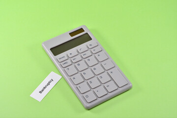 Photo of a calculator and bankruptcy