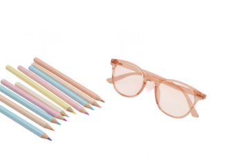 Collection of pastel colored pencils arranged neatly beside stylish peach tinted sunglasses isolated on transparent background
