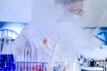 A dedicated Indian researcher analyzes a biological sample in a lab, contributing to medical...